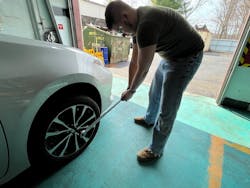 When applying the final torque on a wheel lock with a manual torque wrench, apply slow and steady pressure to the end of the wrench until the wrench clicks when the torque is reached.