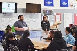 Julie Holmes, co-CEO of Virginia Tire & Auto, was invited by Eric Goldwin of Manassa City Schools to talk to female high-school students about the automotive industry at Osbourn High School in Manassas, Va.