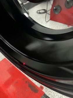 HP and UHP tires can be sensitive to the wheels on which they are mounted. That makes accurate rim runout measurements critical. Here, a laser is measuring the bead area.