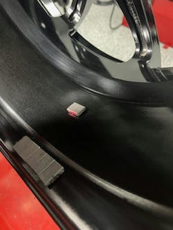 A small amount of weight is needed to achieve optimal balance. Here, the tape weight is placed at the center mass of the assembly.