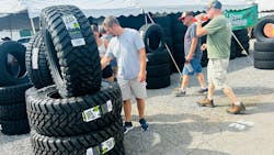 On the Bloomsburg (Pa.) Fairgrounds midway, Steve Shannon Tire employees, operating out of a large tent, sold tires to attendees. The dealership brought 600 units to the three-day event.