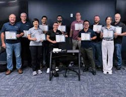 The proud participants with smiles and certificates.