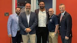 Tony Gonzalez (pictured second from left), the CEO of Tire Group International LLC, says that it has been 'both a blessing and a privilege to give back to Christopher Columbus High School.'