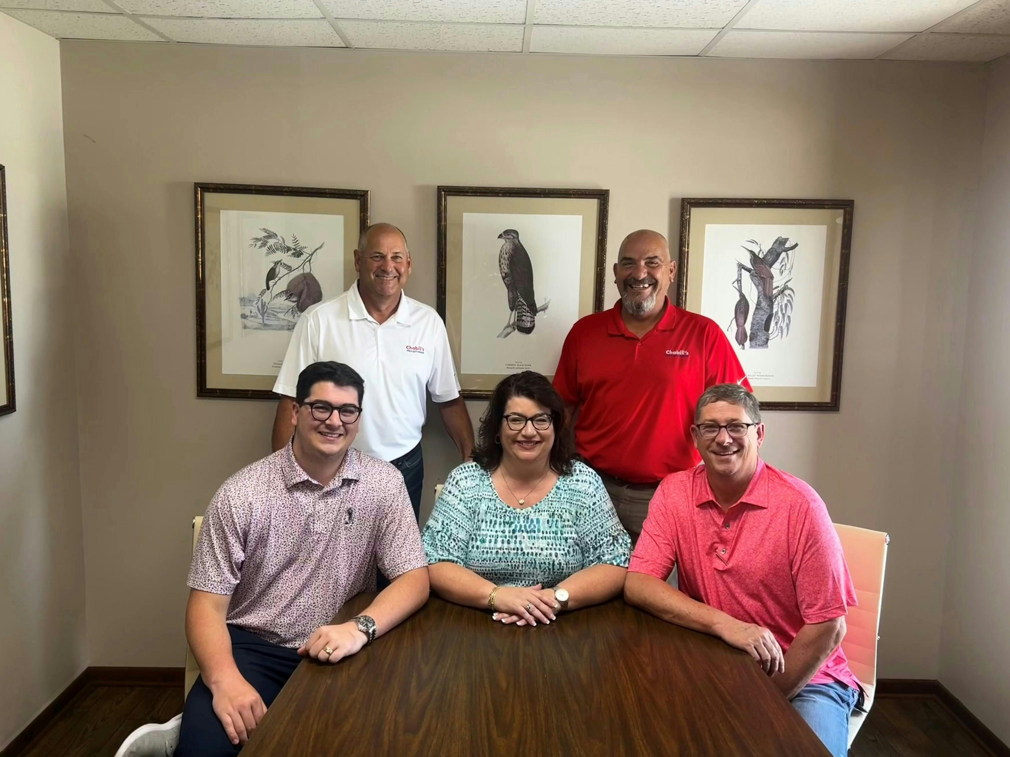 Beth Barron leans on her executive team to lead and grow Chabill's Tire & Auto Service. Front row from the left is her son, Charlie Barron, Barron, and her husband Carey Barron. Back row from left is Eric Roundtree and Martin Michel.