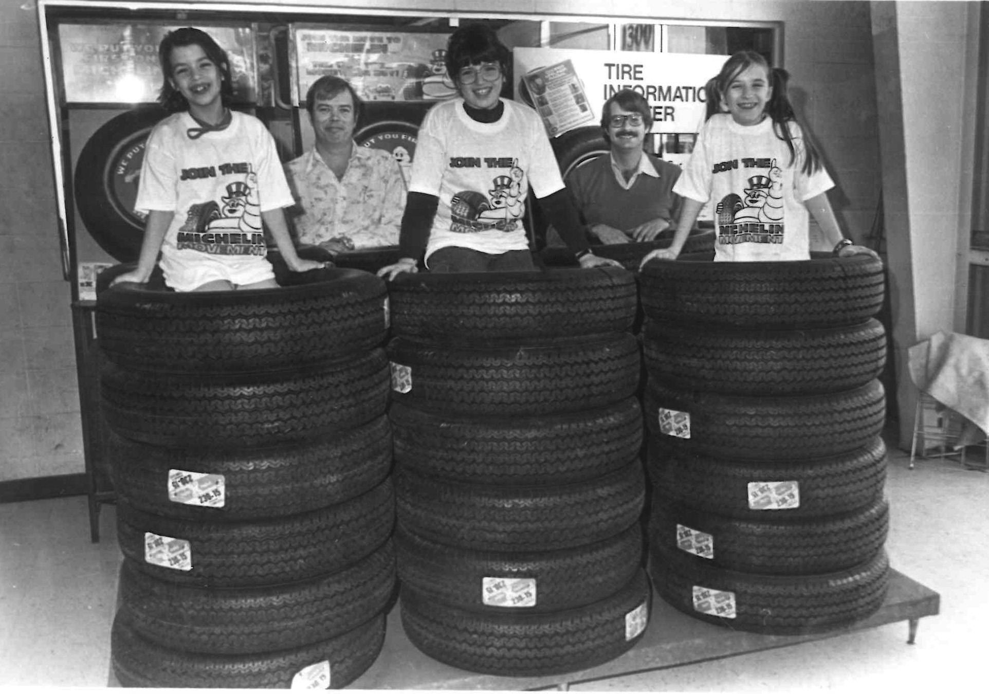 Beth Barron has grown up alongside her family's tire dealership, and that almost automatically equates to having photos of herself amid stacks of tires. Here she's pictured at the far left next to her sister Catherine and a cousin. Her father Charley Gowland is pictured in the back row between his two daughters and alongside a former Cooper Tire & Rubber Co. employee.
