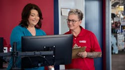 Beth Barron is the third woman honored as a Tire Dealer of the Year — two other women were named alongside their husbands. Barron is the first sole female tire dealership executive to win the award. She's pictured here with manager Heather Guarisco, who leads the company's three-time store of the year.