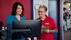 Beth Barron is the third woman honored as a Tire Dealer of the Year — two other women were named alongside their husbands. Barron is the first sole female tire dealership executive to win the award. She's pictured here with manager Heather Guarisco, who leads the company's three-time store of the year.