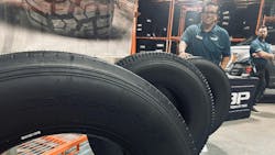 Turbo Wholesale Tires LLC displayed several of its new Rolling Big Power TBR tires during a recent open house event at the company’s Hammond, Ind., distribution center. (Pictured behind tire, JD Casas, Turbo's national sales manager, commercial.)