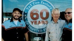 Three generations of Ed Tucks celebrated T&T Tire's 60th anniversary in 2015. Eddie Tuck Jr. is in the center, with his son Ed Tuck III, on the right, and his grandson Edward Tuck IV, on the left.