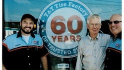 Three generations of Ed Tucks celebrated T&T Tire's 60th anniversary in 2015. Eddie Tuck Jr. is in the center, with his son Ed Tuck III, on the right, and his grandson Edward Tuck IV, on the left.